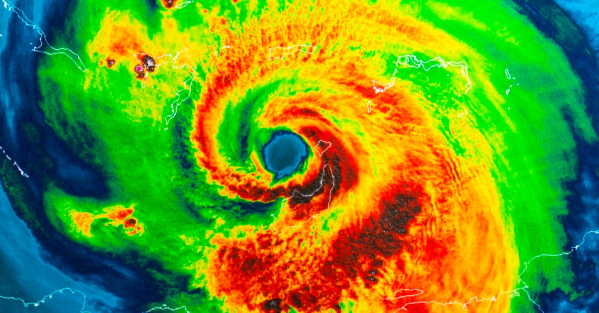 A thermodynamic image showing a swirling heat signature of a cyclone: blue in the eye at the centre, radiating out to red, orange, green, and eventually blue.