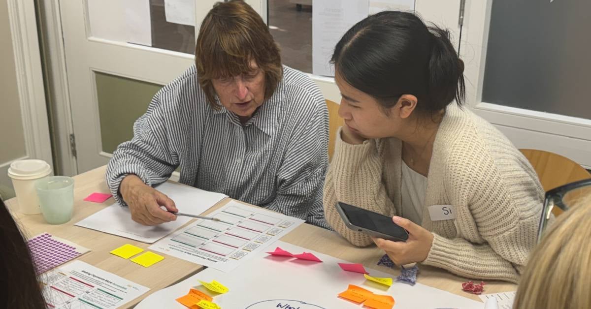 A Voice® community member and researcher work together.