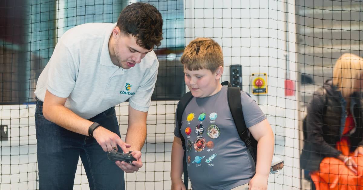 Image shows Kohtari and Northumbrian Water taught visitors how to fly mini drones as part of the Smart Skies Challenge