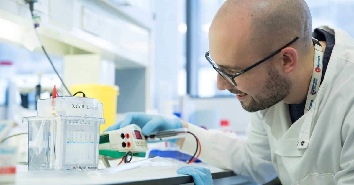 Researcher in a lab conducting an experiment