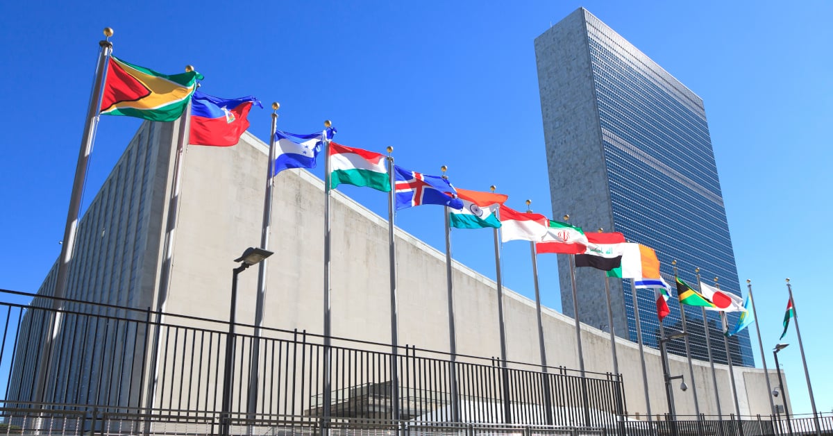 A line of flags bordering the United Nations HQ building in New York.
