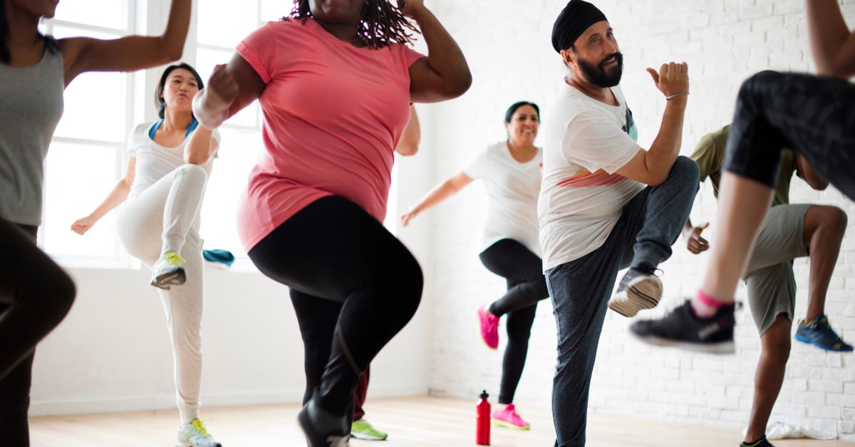 Group of men and women enjoying an exercise class