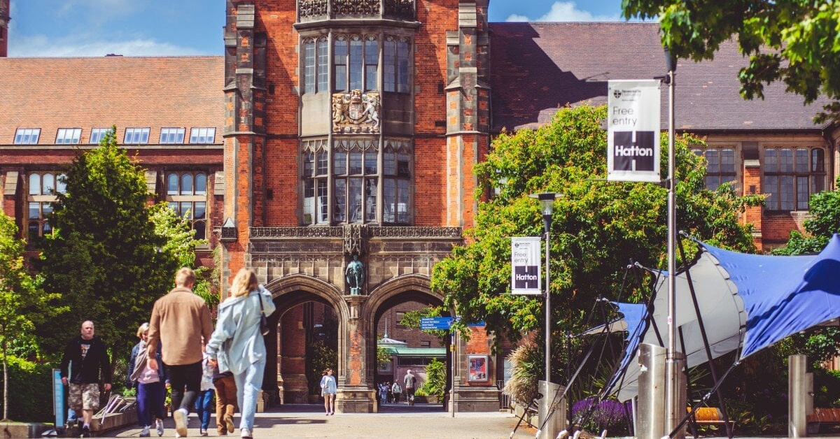 Students walk around the iconic Arches building at Newcastle University.