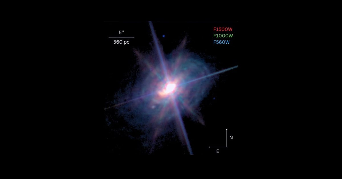 Image of the galaxy ESO 428-G14 as captured by the James Webb Space Telescope - a white flare against a black background.