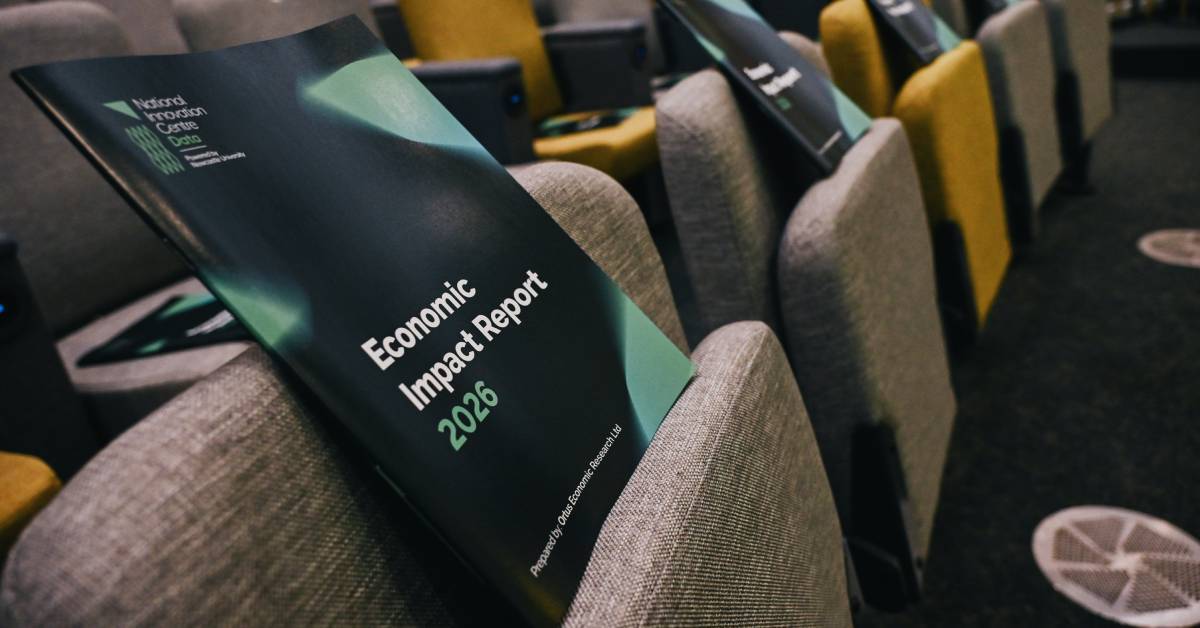 Image shows the NICD Impact Report propped on a chair at an event