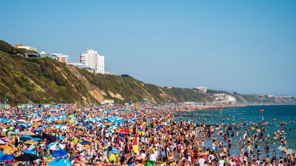 Thousands of sun seekers pack the beach, Bournemouth, Dorset
